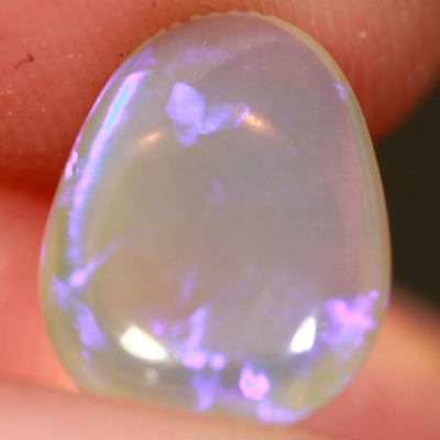 SOLID CRYSTAL OPAL Transparent with a pretty purple jumping